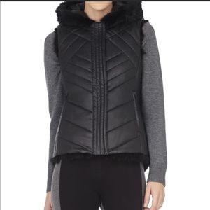 Reversible fur and faux leather hooded vest